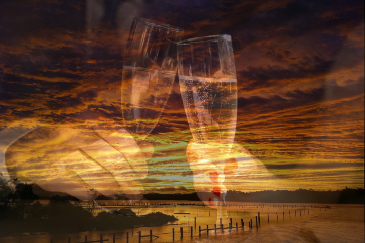 Enjoy a glass of bubbly on a sunset lake dinner cruise - Free Spirit Cruises - Forster